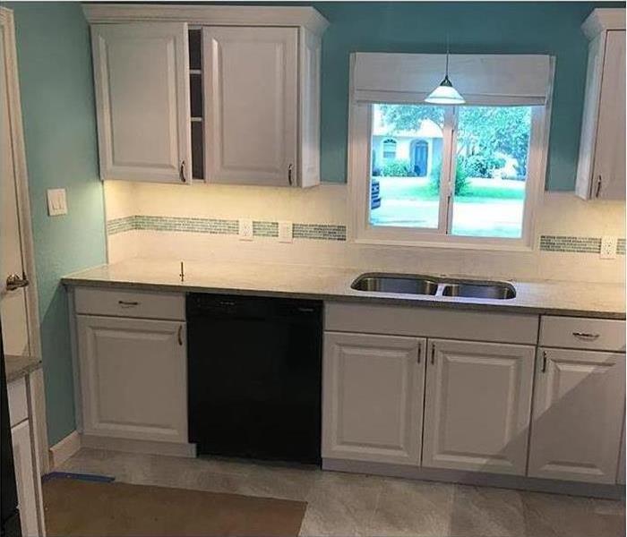 SERVPRO cleaned and restored kitchen with white cabinets in Orlando, FL