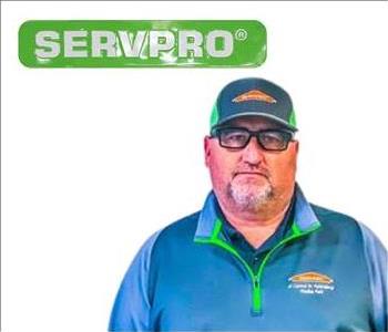 Jeff, SERVPRO employee, in uniform, in front of white background