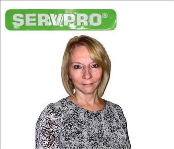 Janice, SERVPRO employee under green sign